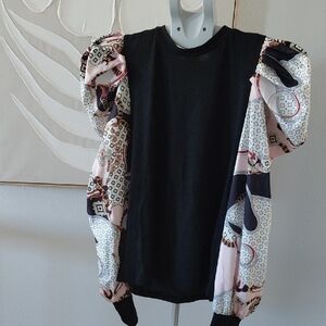 Elegant Black Top with Patterned Sleeves